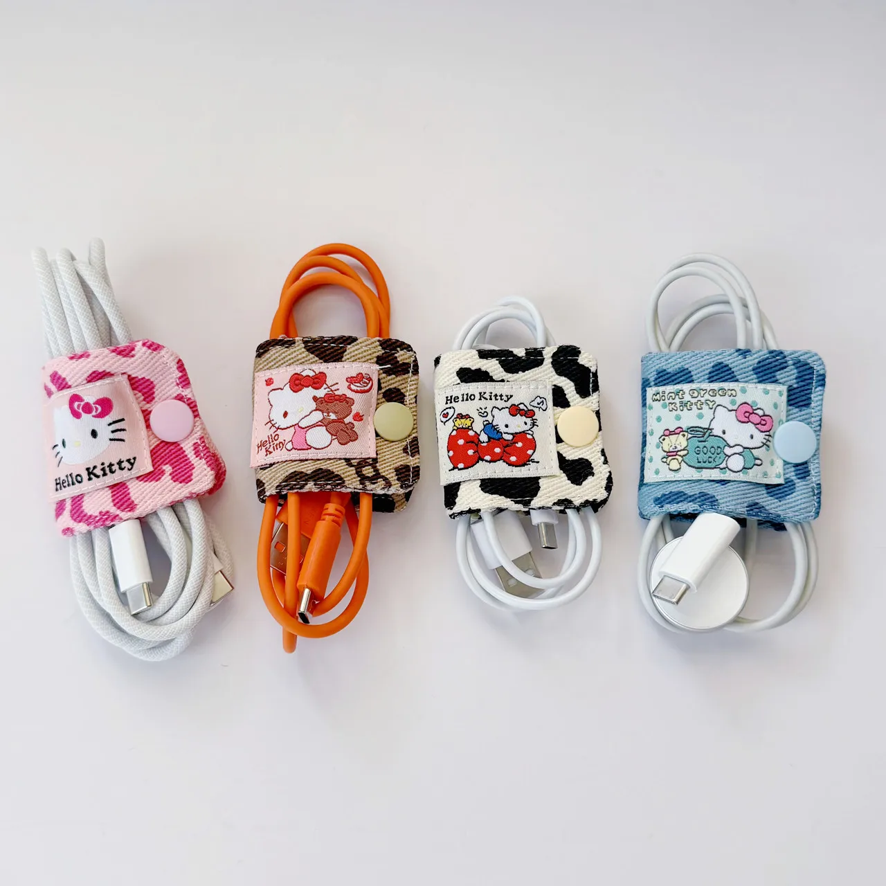 Lindo KT leopardo tela vaquera Cable de datos Clip de almacenamiento hecho a mano Kitty Cable de carga bolsa de almacenamiento cepillo almacenamiento