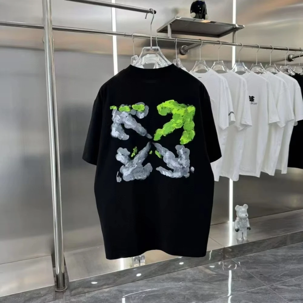 2025 العلامة التجارية الكورية العصرية القطن الخالص قصيرة الأكمام رسمت باليد السهم طباعة الرجال والنساء فضفاضة ومتعددة الاستخدامات تي شيرت #1