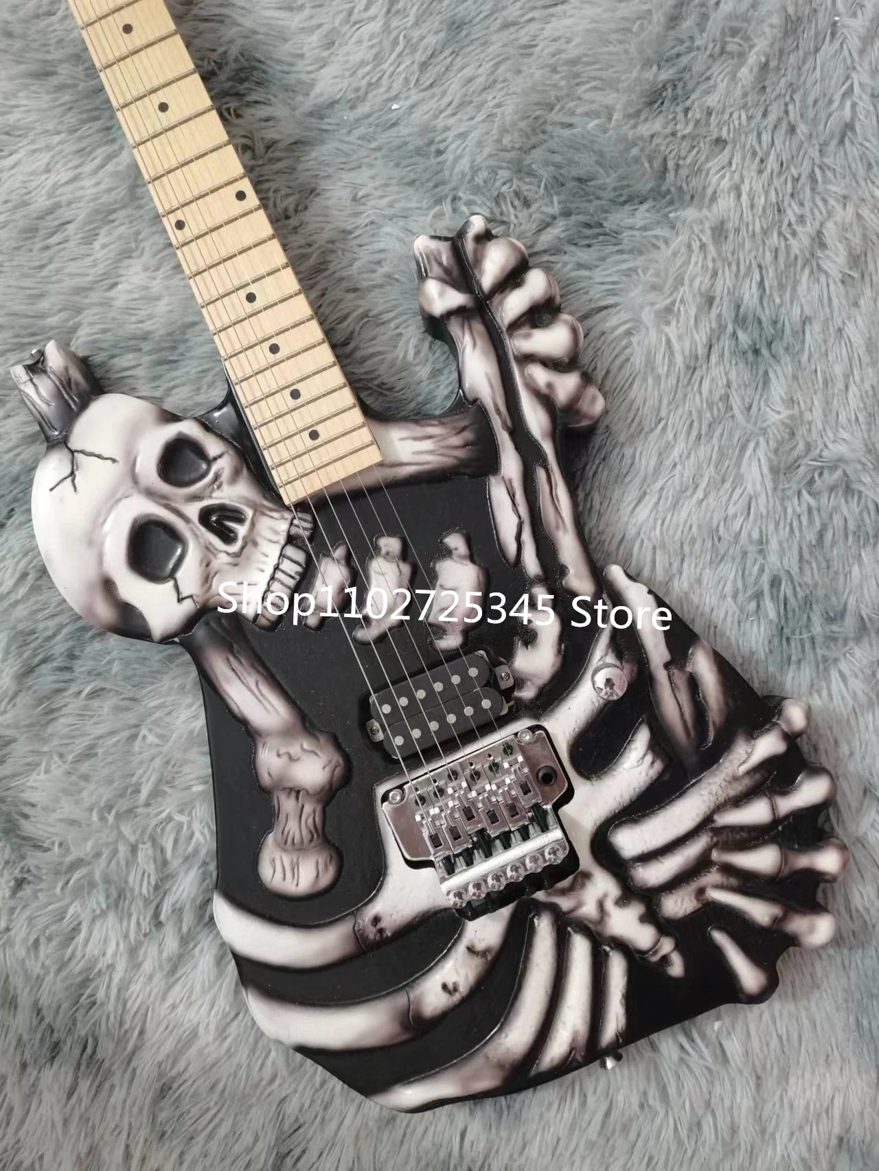 6-string skull electric guitar, maple fingerboard, silver accessories, tremolo system, free shipping