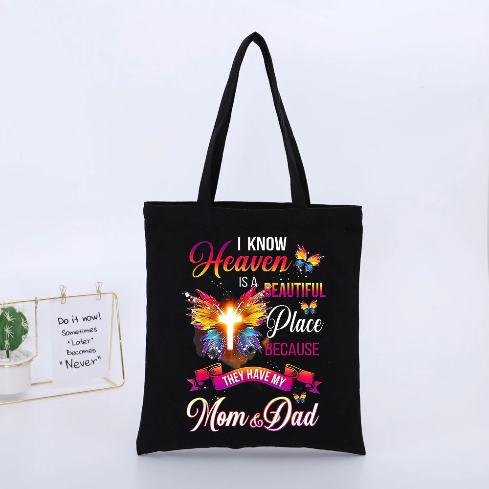 Butterfly and Cross Graphic Canvas Tote Bag with Typography Print, Ideal for Casual Daily Use