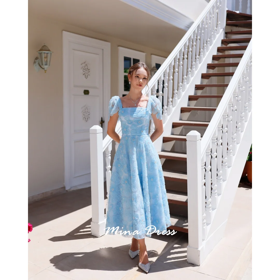 ชุดราตรีสีฟ้าอ่อนแบบสั่งตัดของมิน่า ชุดเดรสงานเลี้ยงสุดหรู ประดับเลื่อม ชุดราตรีผู้หญิงสุดหรูหรา  ชุดราตรีผู้หญิงลายดอกไม้สุดสง่างาม