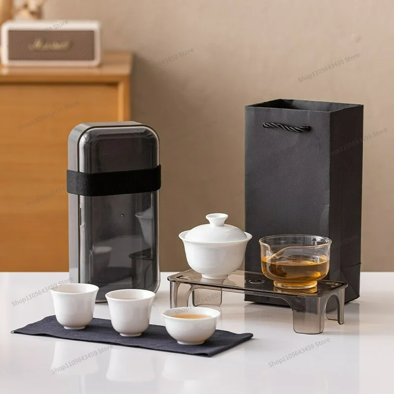 white porcelain travel tea set, one pot and three cups of portable express cup outdoor souvenir