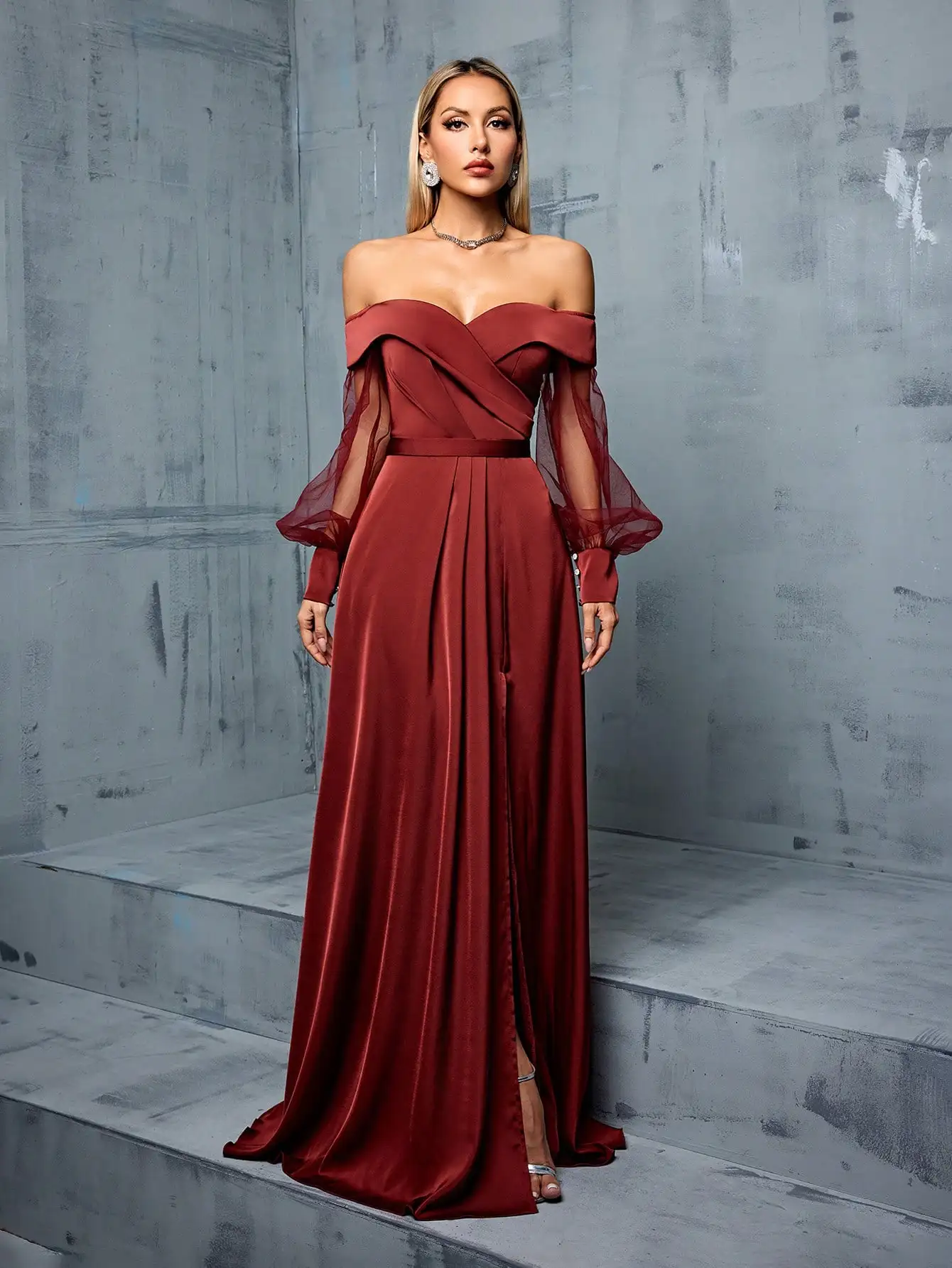 Bridesmaid's floor-length gown with off-shoulder neckline, mesh-satin paneling, and side slit