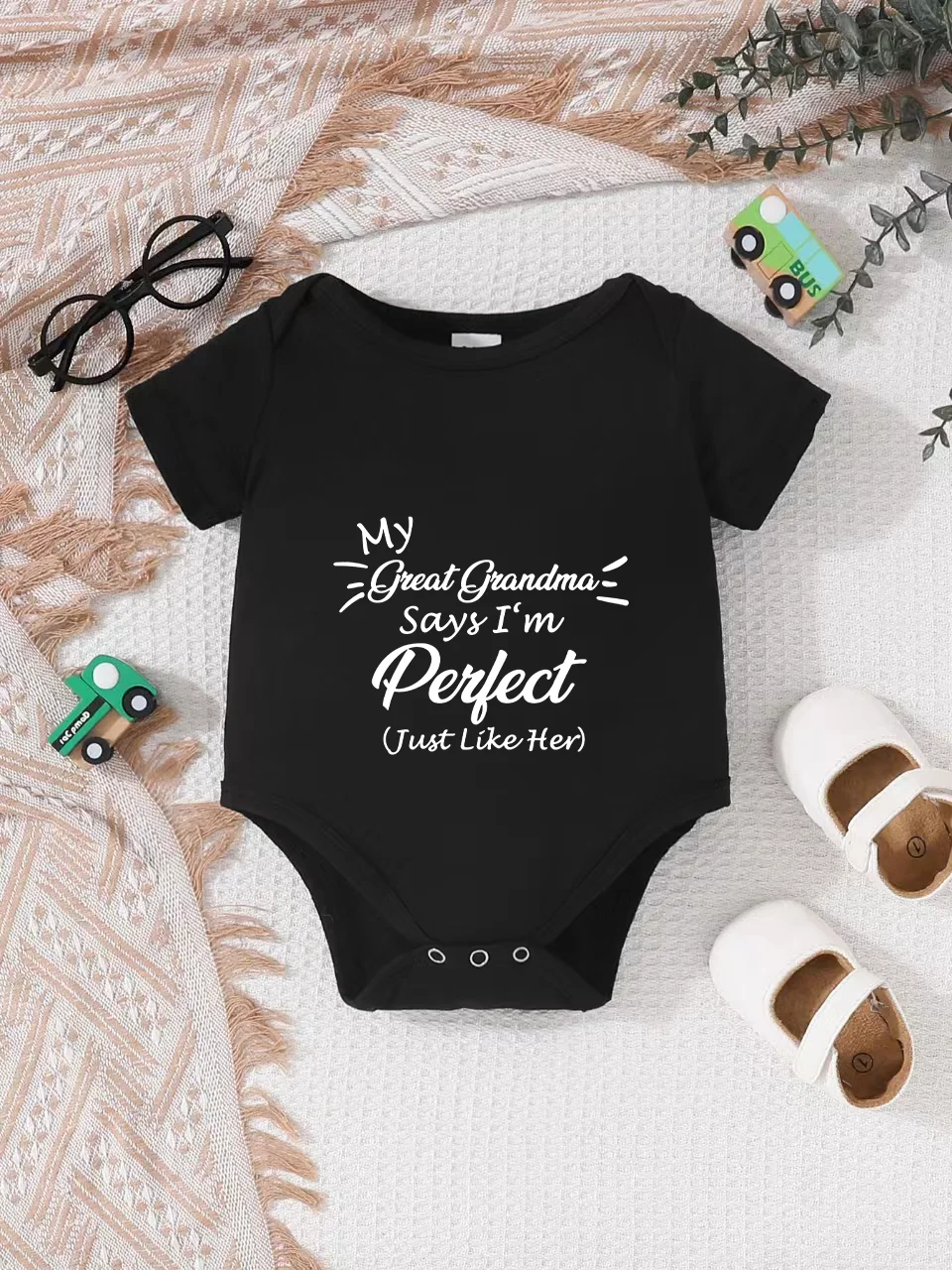 Playful letter-printed baby short-sleeve triangle bodysuit. Button closure for easy dressing