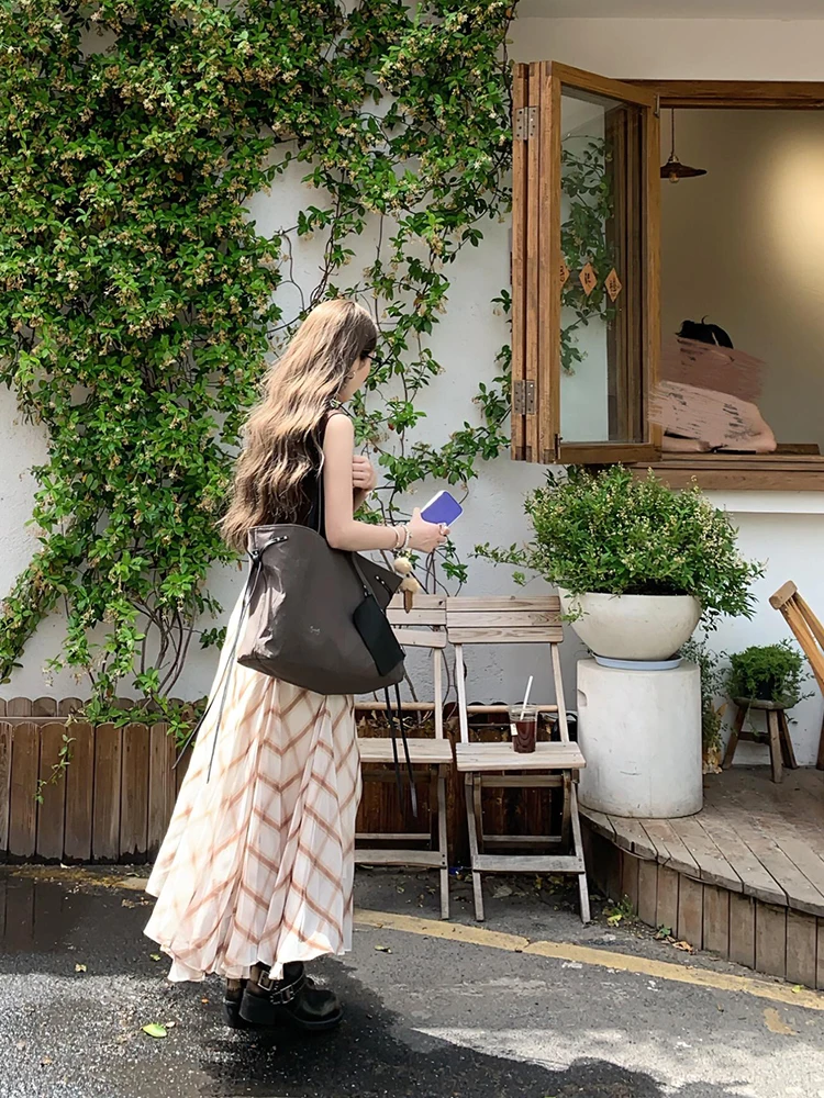 패셔너블한 레트로 디자인 매듭 끈 민소매 조끼 여성용 여름 2025 캐주얼 다용도 탑 우아한 드레이프 트위스트 매듭 스타일