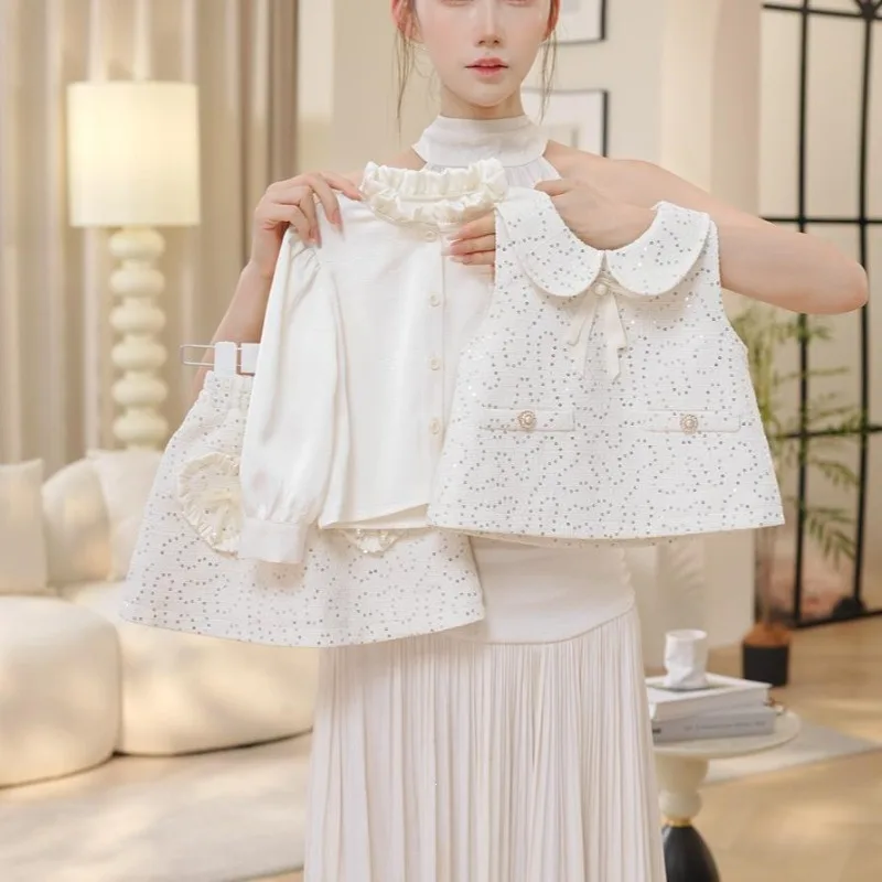 Girl doll collar sequin vest coarse tweed three piece set autumn pearl bow heart pocket half skirt set