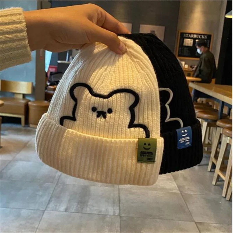 

2024 Winter Embroidered Knitted Hat with Children's Warmth and Ear Protection Fabric Label Knitted Hat Versatile