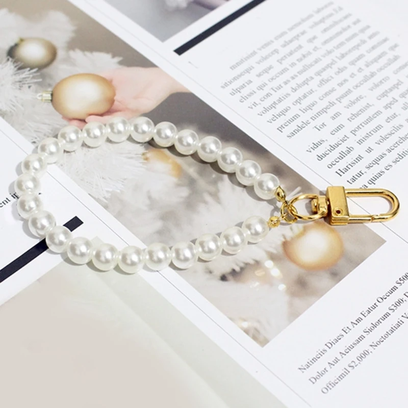 Bracelet de téléphone élégant avec perles pour femmes, chaîne de poignet, porte-clés, clés de voiture, pendentif, à la mode