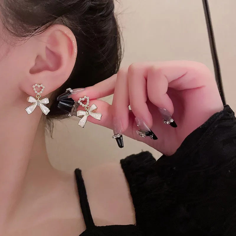 925 Silver Needle Korean Fashion White Bow Drop Earrings For Women Jewelry 2026 Trending New Women\'s French Pearl Earrings JN9