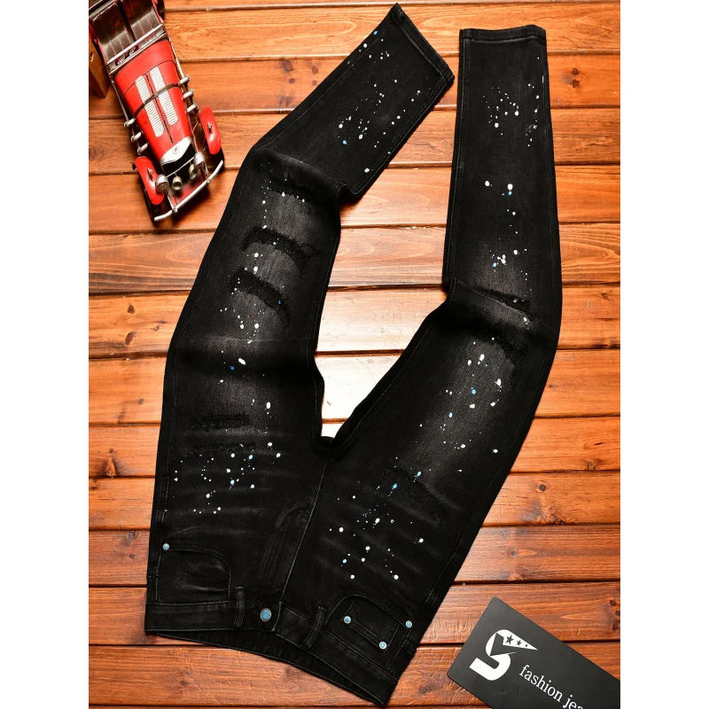 Jeans nostalgici retrò autunnali da uomo neri in difficoltà con stampa di vernice slim fit piedi piccoli pantaloni belli con volant da strada alla moda