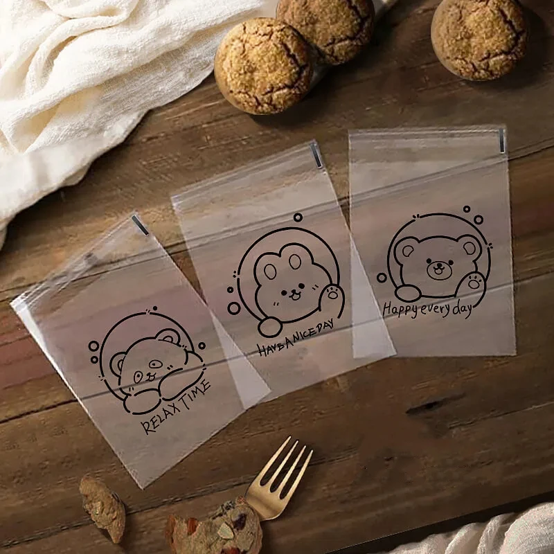 100 Stück transparente Brot-Geschenkverpackungen mit niedlichem Cartoon-Bärenmuster, selbstverschließende Beutel, quadratische Beutel mit Feiertagsgruß-Aufdruck – Detail 3
