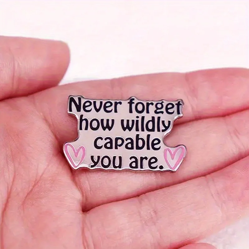 "Nunca olvides cómo capaz salvaje eres". Broche con letras divertidas para mochila, pantalones vaqueros, abrigo, sombrero