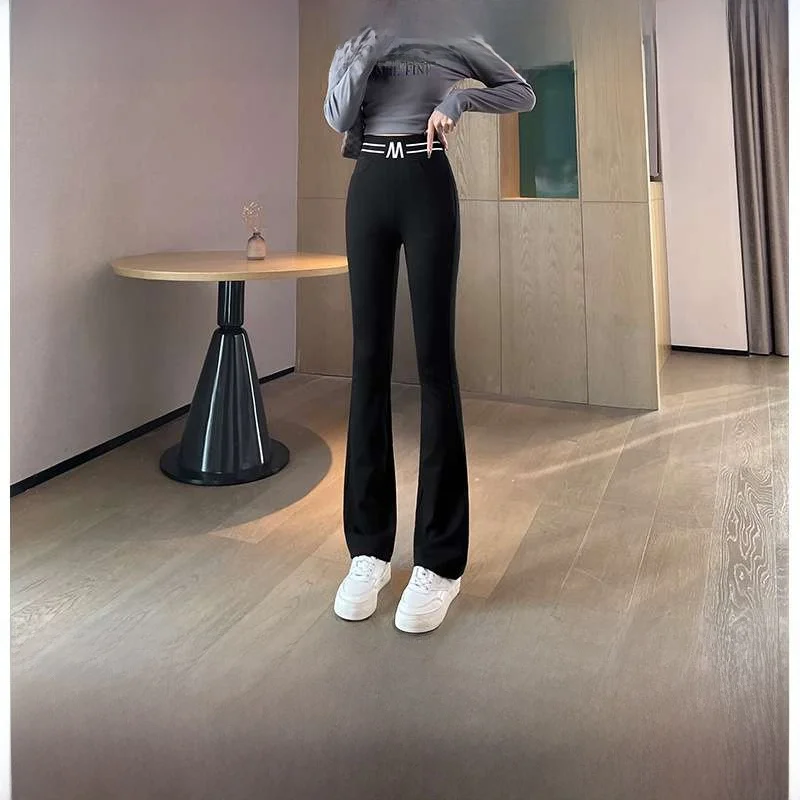 春秋の女性のカジュアルなフレアパンツロングナインポイントカプリパンツ快適なルーズフィットストレートレッグパンツ