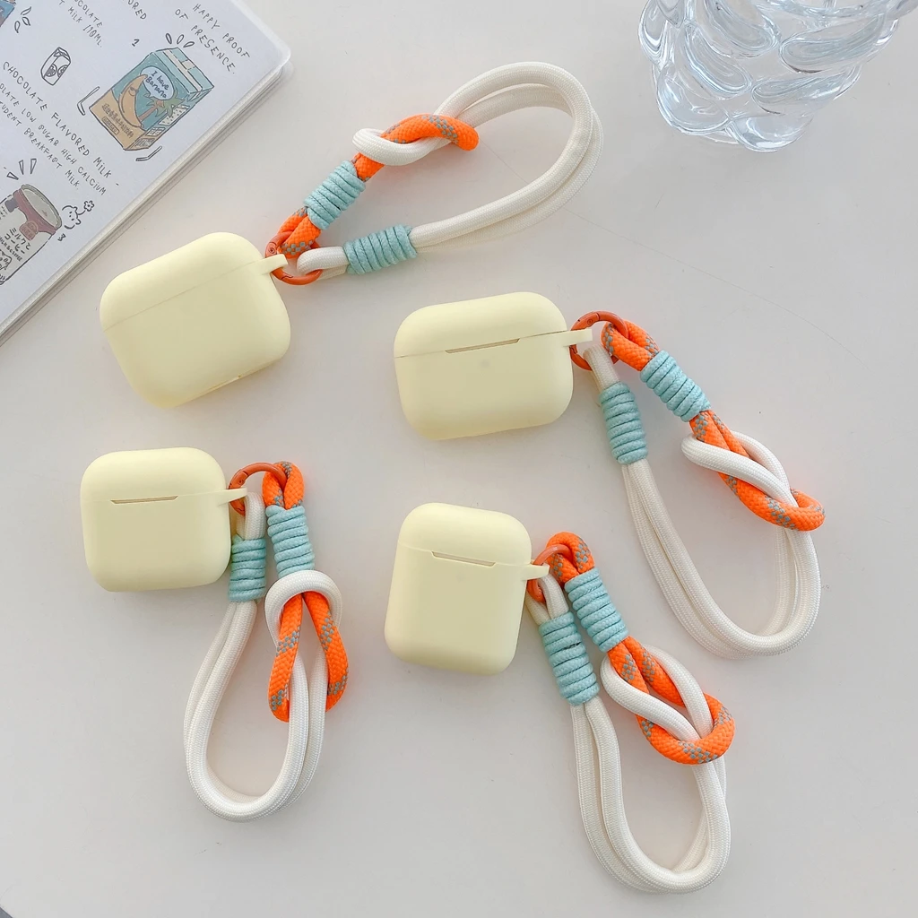 Minimalistische, gelbe, weiche Silikonhülle mit geflochtenem Trageband zum Schutz der Kopfhörer für AirPods 1 oder 2, 3, 4, 5, Pro 2, Pro 3.