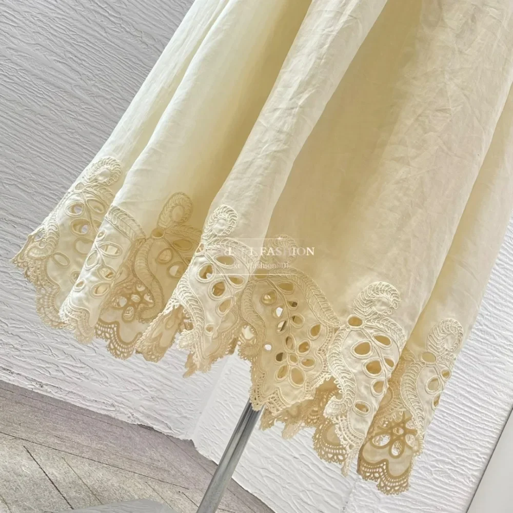 Vestido midi sin espalda con corte bordado sin mangas beige 2025 Ramio