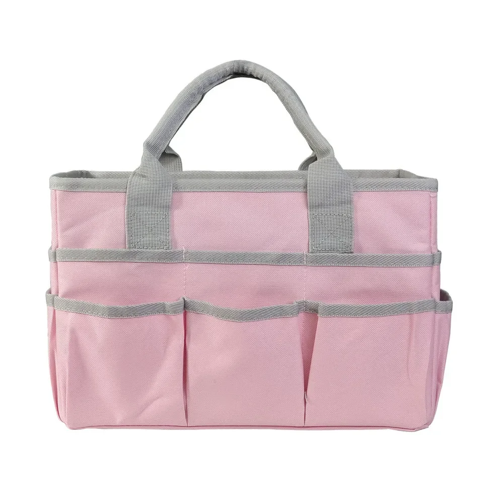 

Green and black garden tool tote with multiple pockets for organized storage of gardening supplies and classroom materials