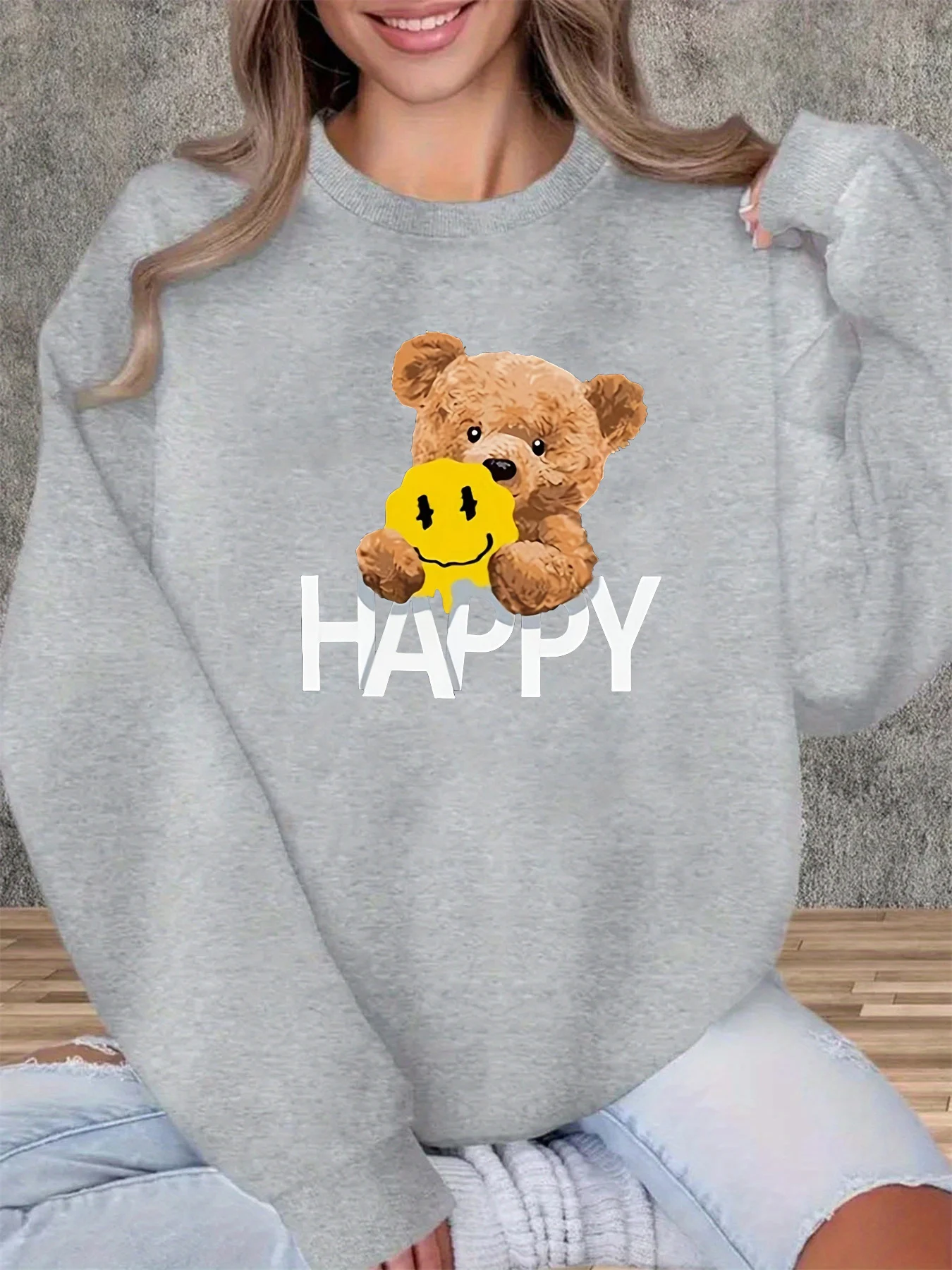 Damska jesienno-zimowa luźna i wygodna ciepła bluza z okrągłym dekoltem, długim rękawem i nadrukiem z motywem misia HAPPY.