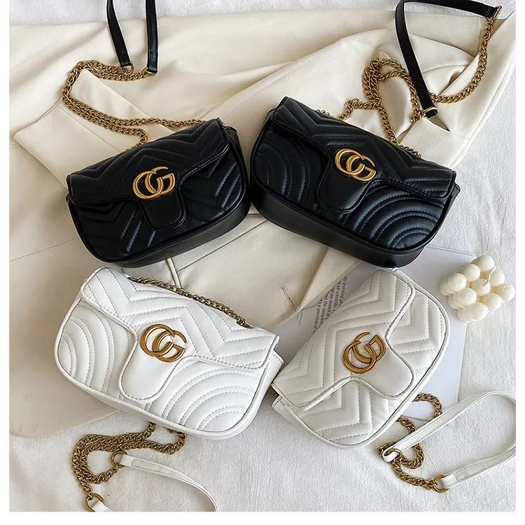 حقيبة كتف احترافية أنيقة للنساء أثناء السفر مع مادة من جلد الغزال ومقصورات متعددة وسطح ناعم ومريح