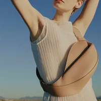 2025 nuevo bolso de cuerno de moda, bolso cruzado de piel de vaca suave de viaje de nicho personalizado con forma de almohada de gran capacidad