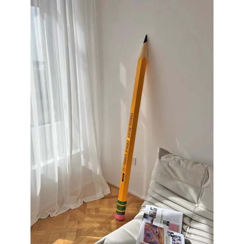 Large giant pencil, art installation, creative floor ornament, library design sculpture