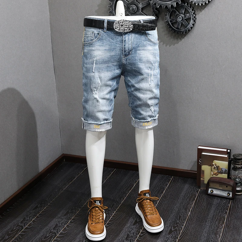 

JXN971 Korean version of the washed white scraping hole elastic trousers jeans men's spring and summer new Slim trend
