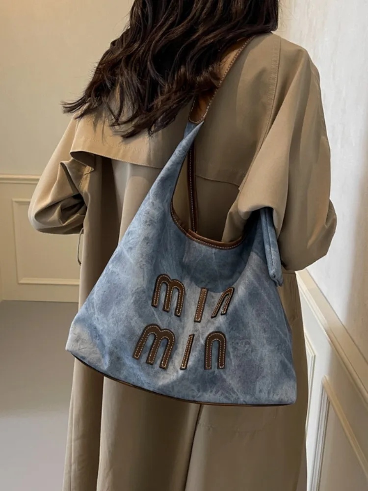 

Luxury designer spring and autumn bags women's large-capacity tote bag 2025 new niche design high-end one-shoulder commuter bag