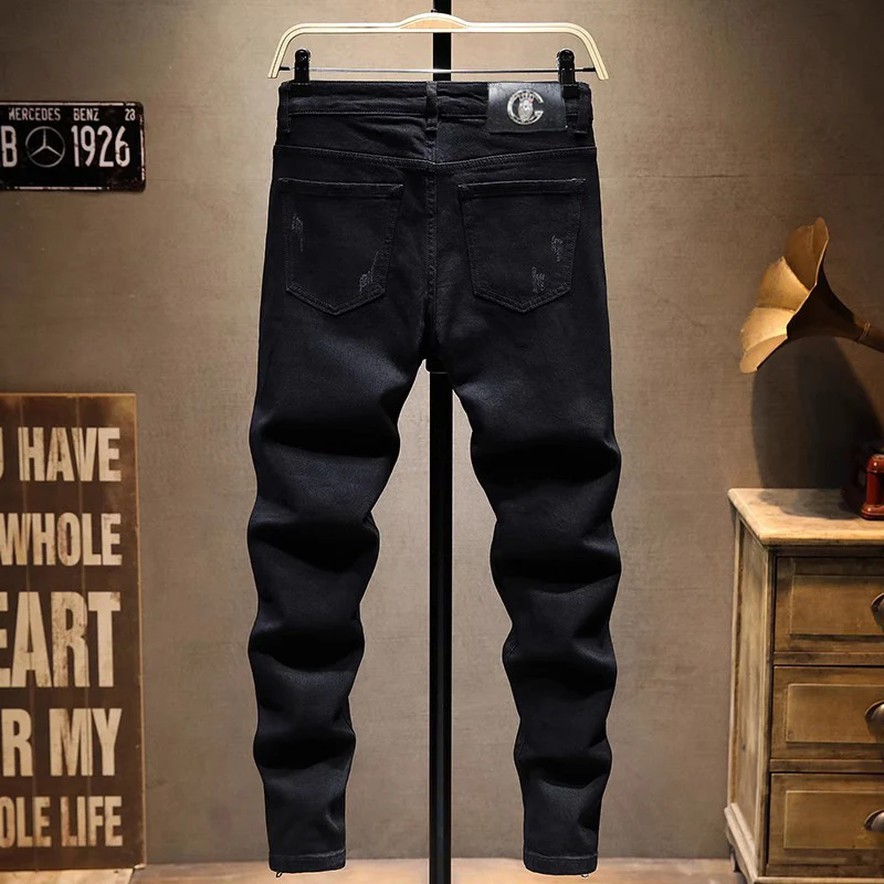 Pantalones vaqueros rasgados elásticos para Hombre, Jeans negros de moda, pantalones Punk con cremallera inferior, pantalones de Hip Hop de diseñador