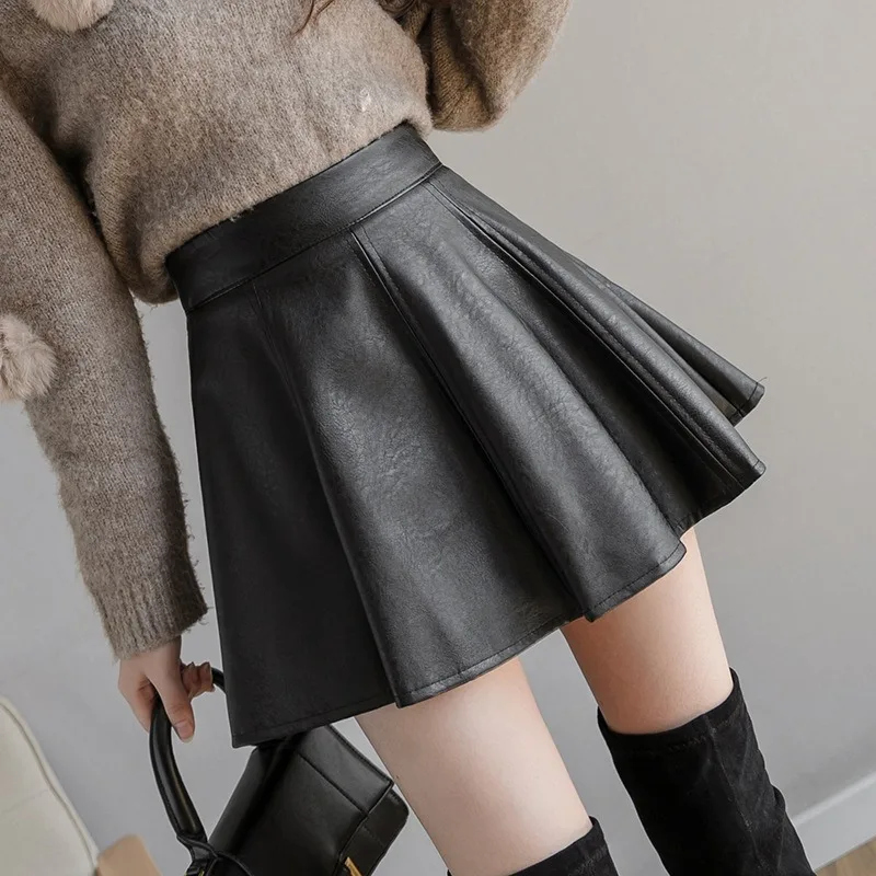 Faldas plisadas de PU de Color sólido para mujer, minifalda de cuero con cremallera única de cintura alta ajustada para invierno, moda de otoño