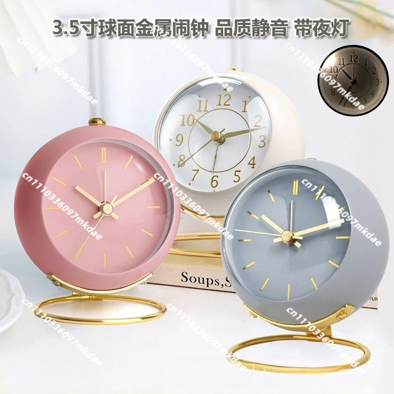Metal silent alarm clock. Luminous creative convex bronzing children's desktop alarm clock with light