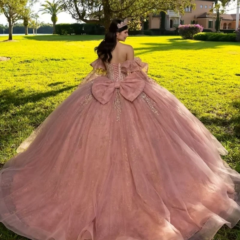 

Pink Shiny Ball Gown Quinceanera Dresses Applique Lace Beading Crystal Bow Tiered Tull Corset Off The Shoulder Sweet 16 Dress