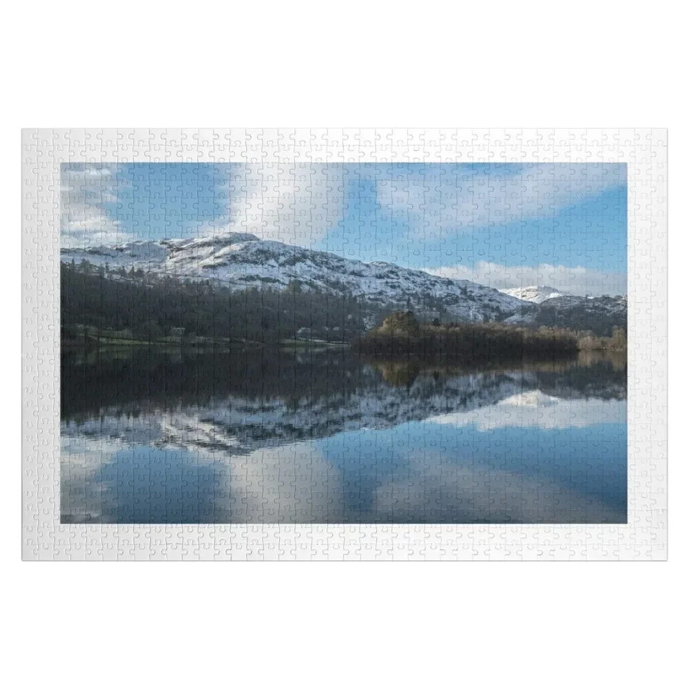 

Grasmere Lake in Winter in the Lake District National Park, with remarkable reflections of the surrounding fells o Jigsaw Puzzle