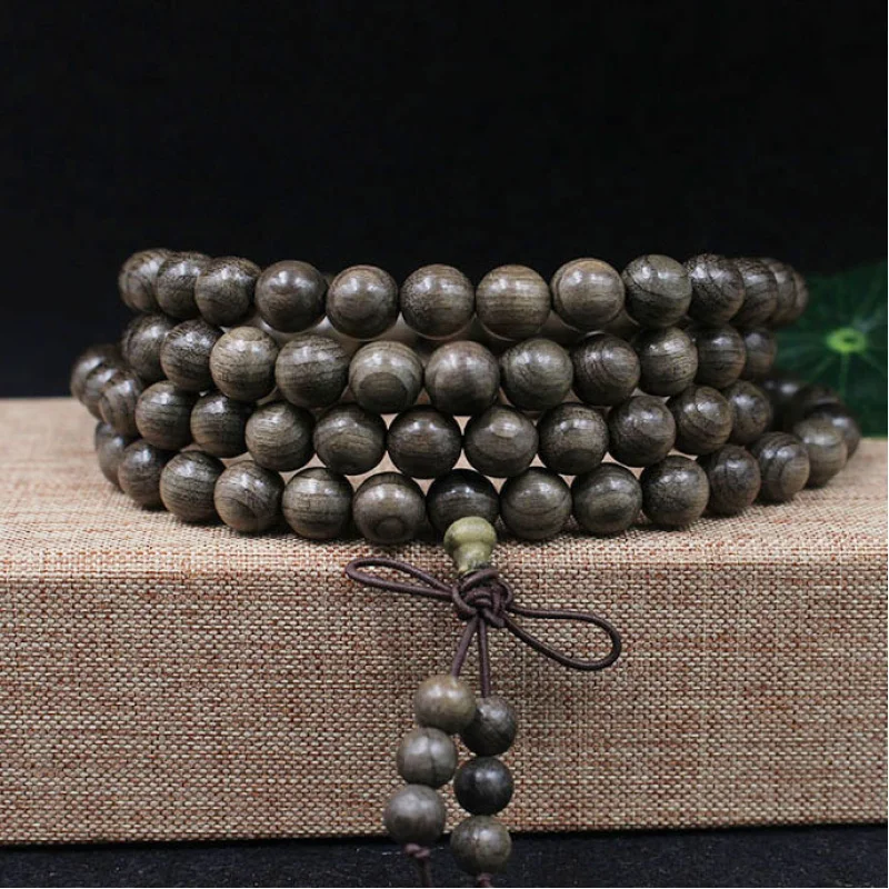 

bracelet. Golden nanmu dark wood Buddhist prayer beads