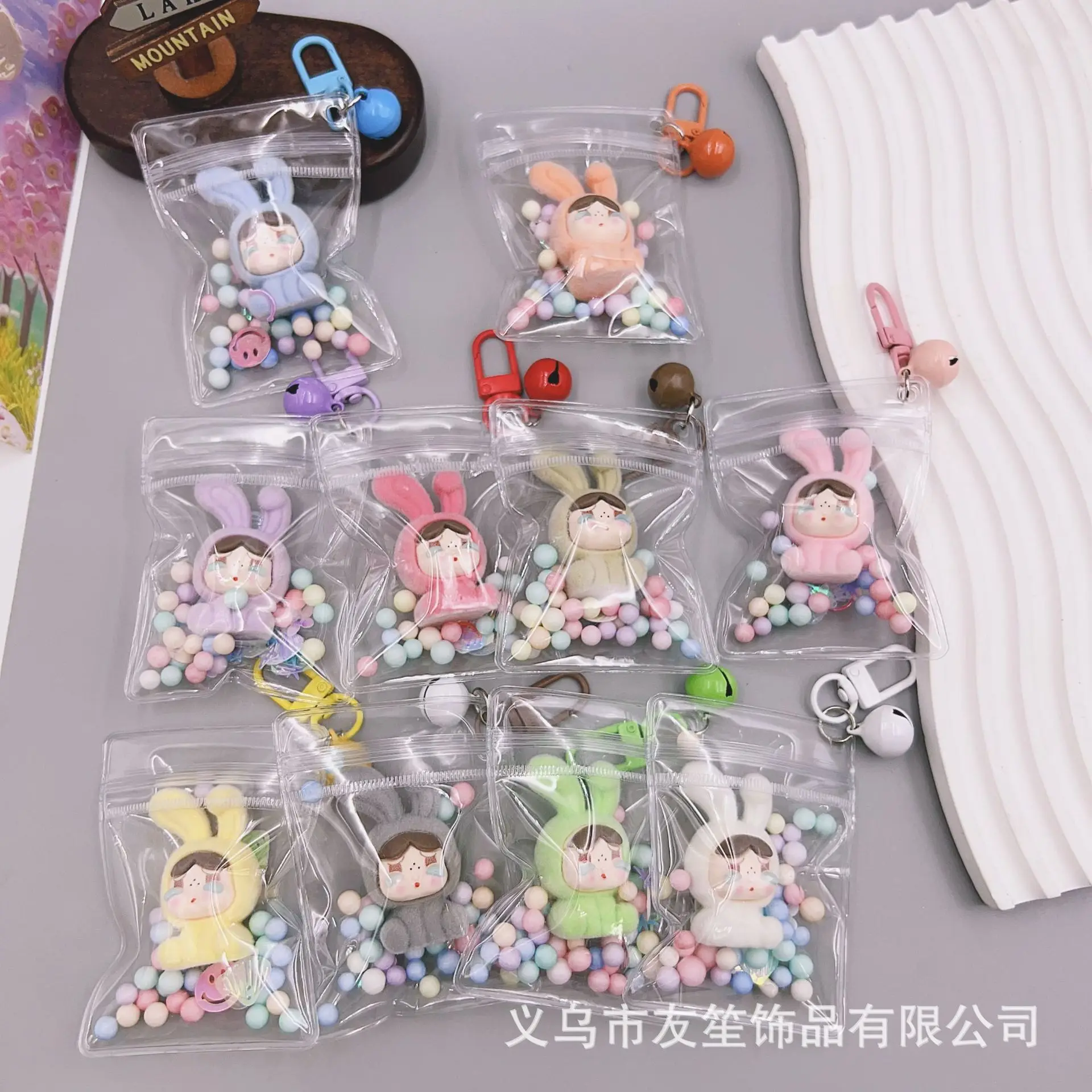 

Transparent dustproof bag hair ball hanging resin doll bell keychain bag