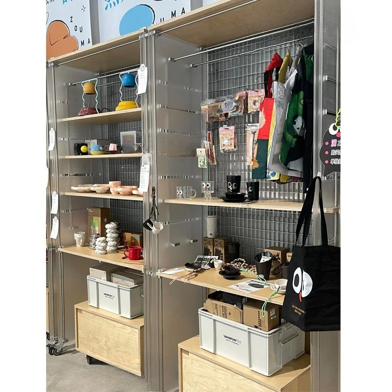 Rak pajang lantai toko pakaian baru yang kreatif, rak lantai papan laut sumbu optik, etalase tas sepatu akrilik