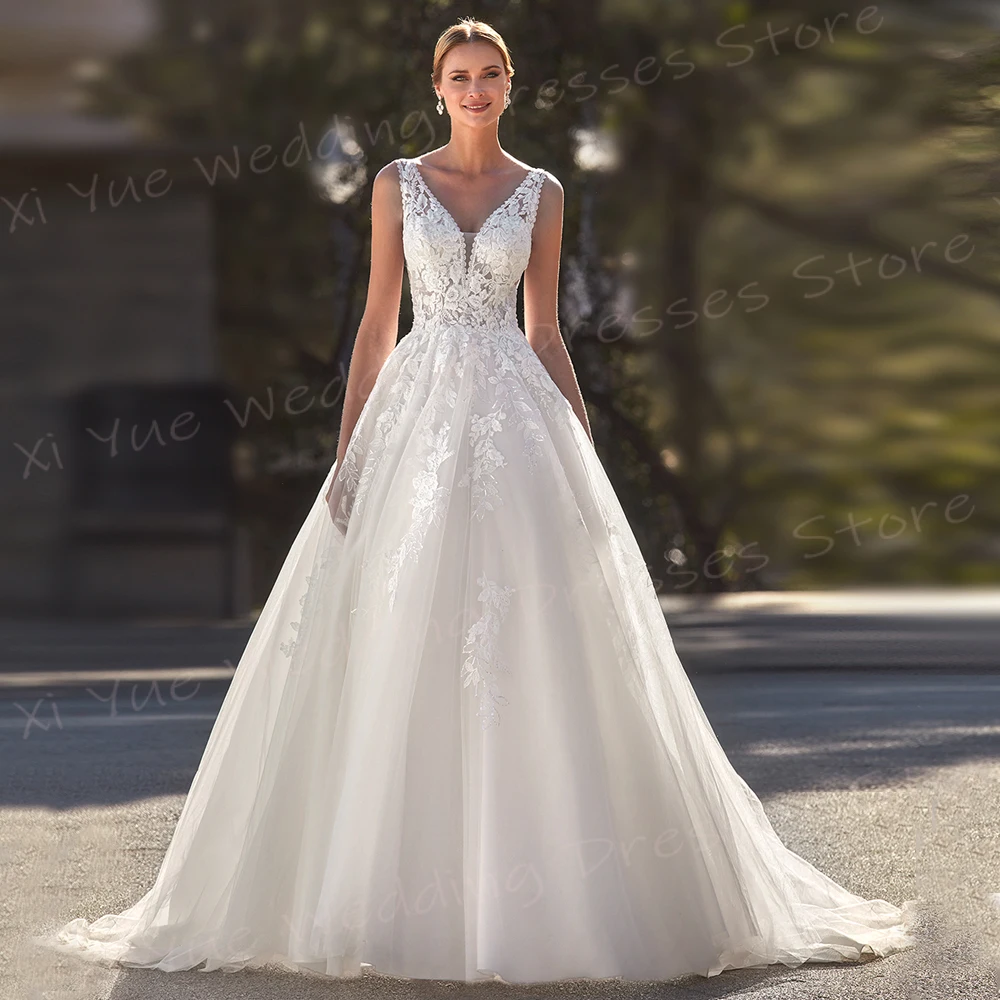 Affascinante Sexy scollo A V una linea abiti da sposa da donna Appliques di pizzo alla moda abiti da sposa senza maniche Backless Vestido De Noivas