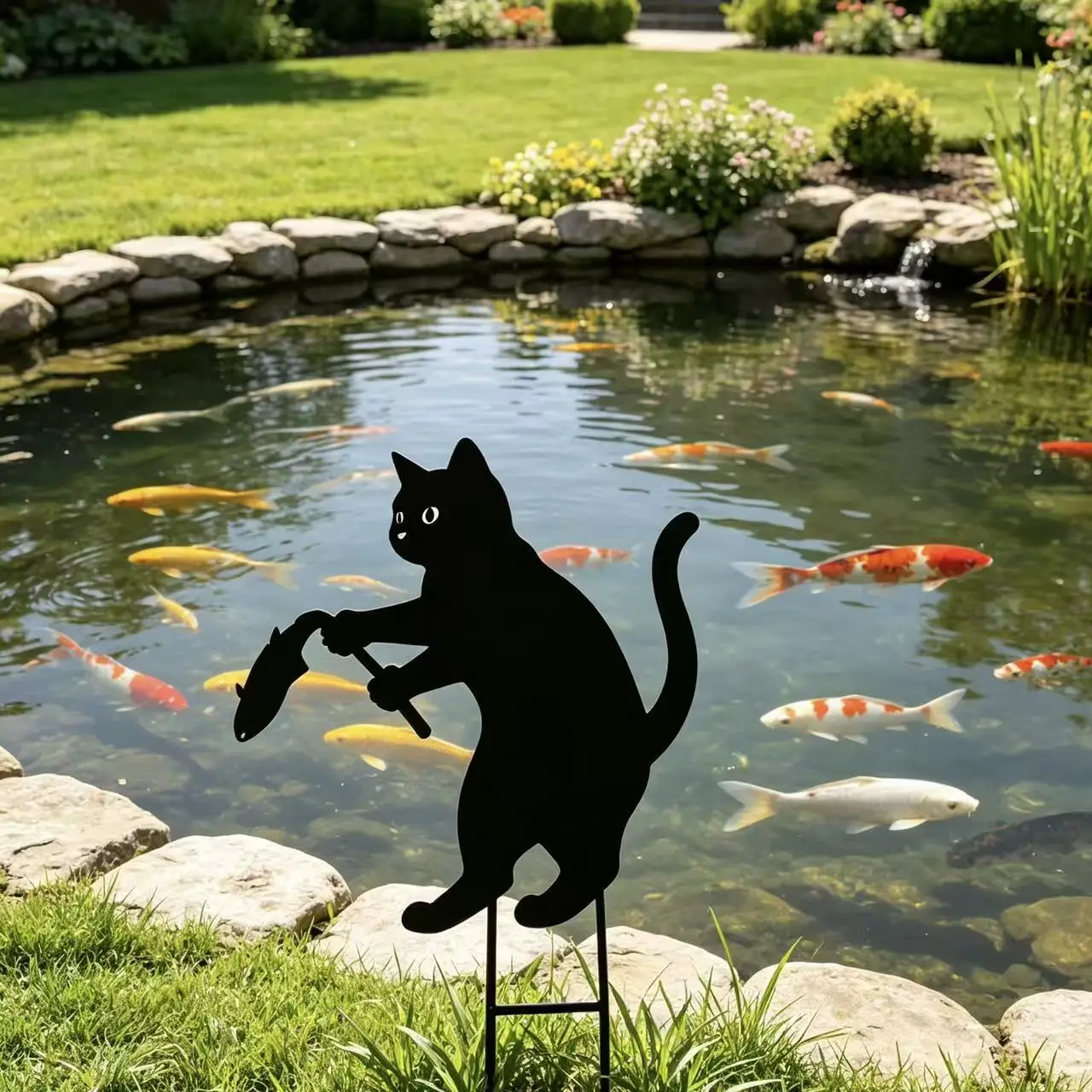 Black cat fishing iron art garden stake, silhouette shape vivid and playful. Lawn courtyard. Outdoor decoration.