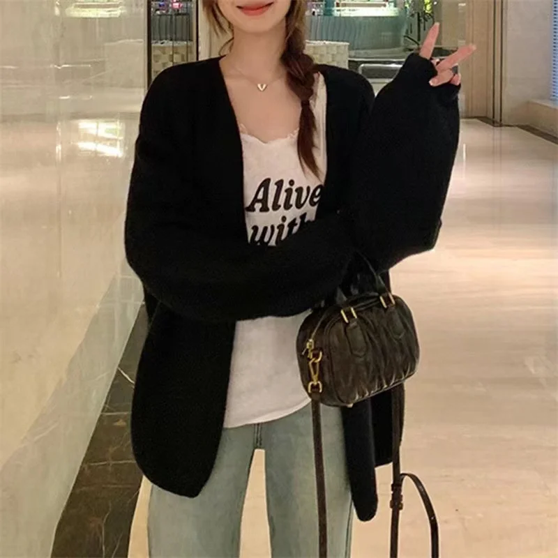 Women's Polka Dot Cardigan faux fur collar detail demonstrating fiber texture and attachment stitching