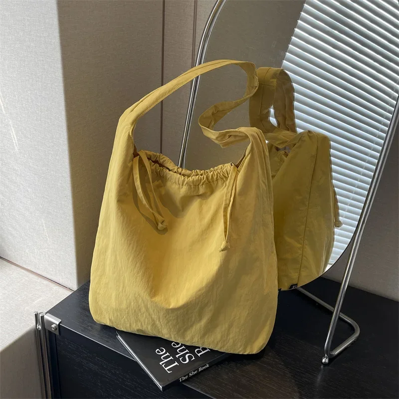 Simple Solid Color Washed Cloth Armpit Commuter Shoulder Bag Casual and Lightweight Ins Wind Drawstring Design Bucket Bag