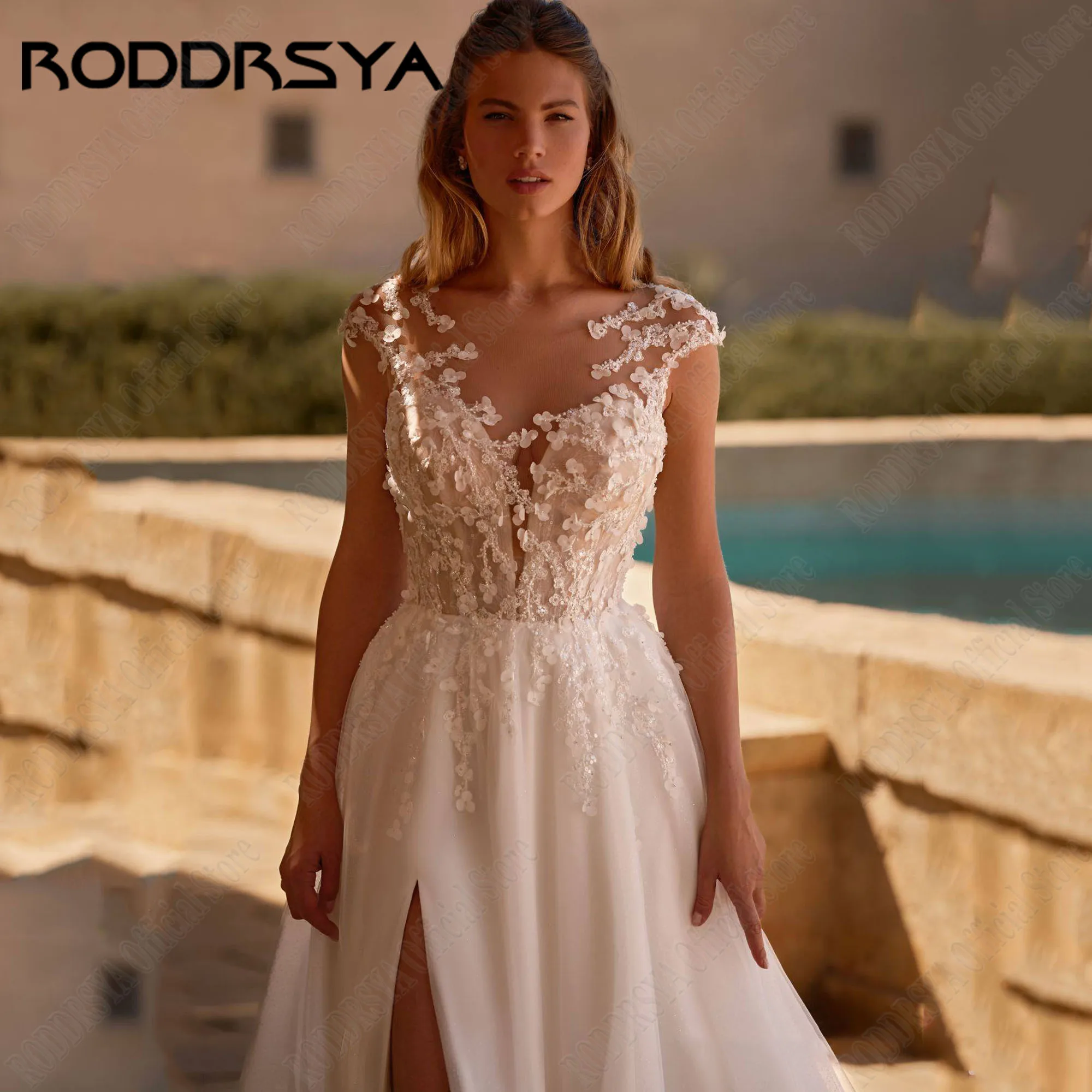 RODDRSYA A-lijn kant trouwjurk voor vrouw cap mouwen kralen zijkanten gesplitste knoop rug ronde hals applique boho gewaadRODDRSYA A-Lijn Kant Bruidsjurk Voor Vrouw Cap Mouwen Kralen Side Split Knop Back Scoop Neck App