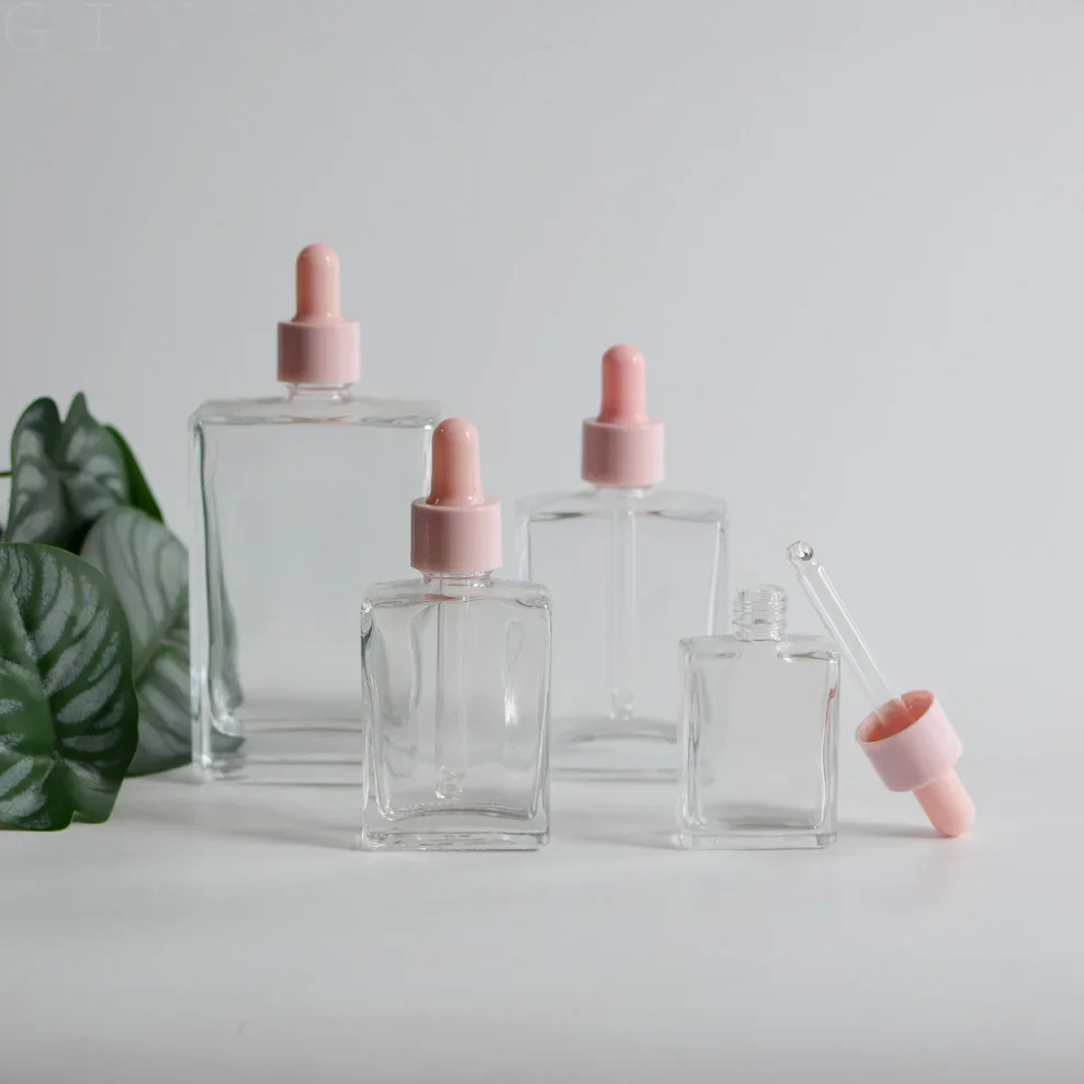 

Empty Square Clear Rectangle Glass Bottle for Dropper Liquid Oils Pipette Vilas With Pink Lid Containers for Cosmetics Packaging