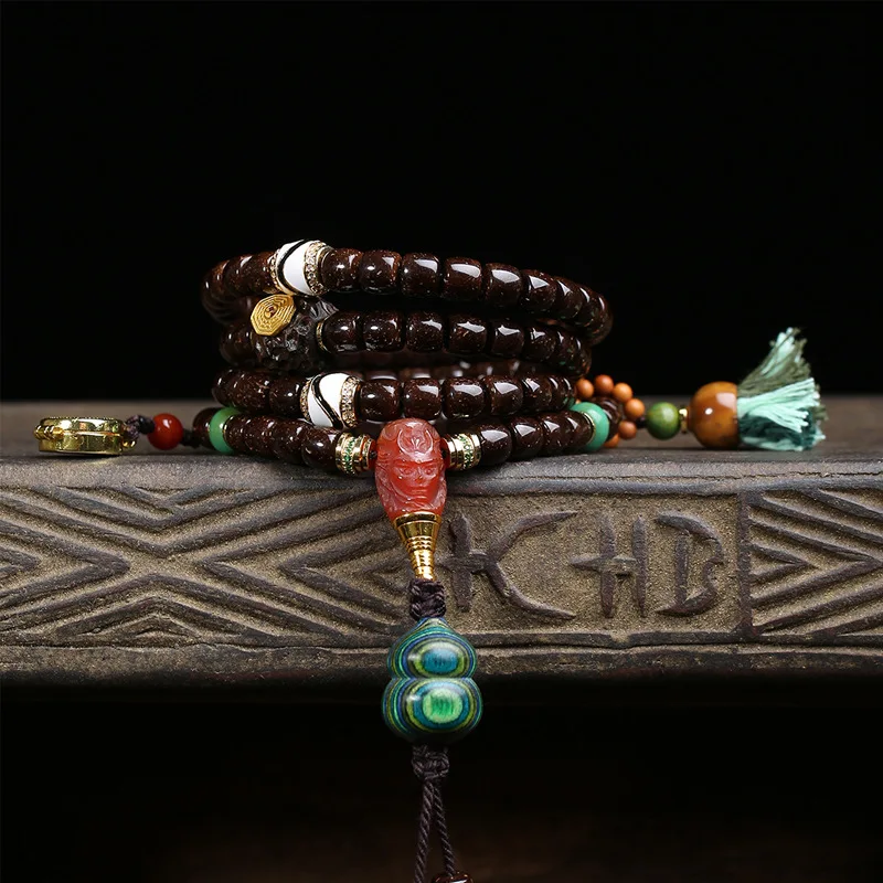 108 natural coconut rind beads, multi-loop bracelet, dZi beads, red agate, and Gawu box accessories