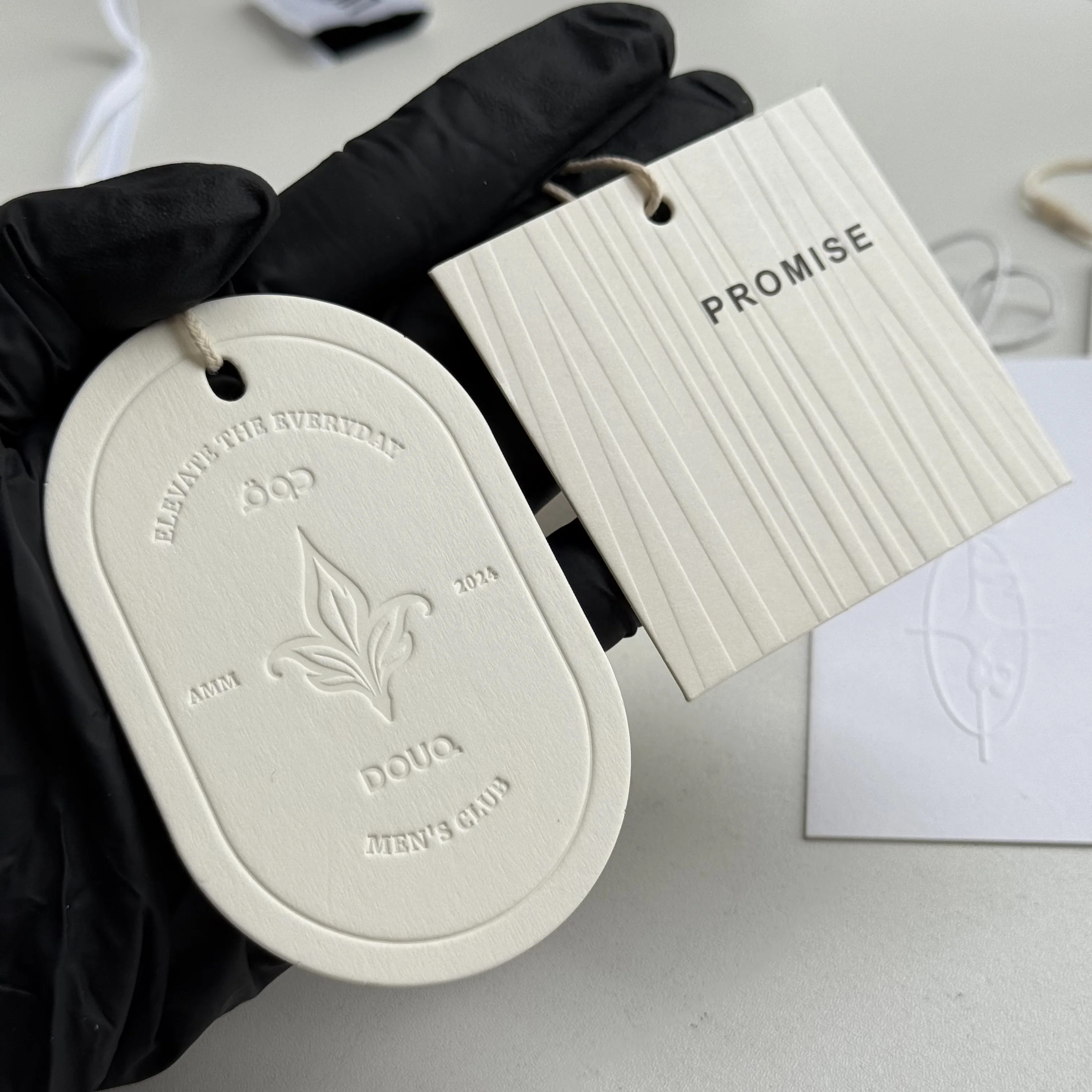 custom-luxury-embossed-logo-hang-tags-custom-brand-price-labels-for-high-end-clothing-bags-and-shoes