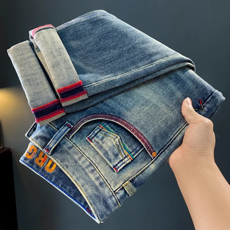 Tren jeans pria baru musim gugur 2025, celana kasual serbaguna berkualitas tinggi, dicuci, elastis, dan nyaman.