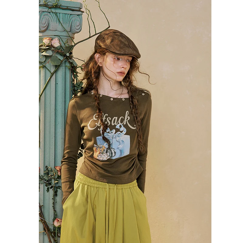 ELFSACK Women's Casual Long Sleeve Graphic Tee with Pumpkin Gift Print, Asymmetrical Neck Ruched Top for Everyday