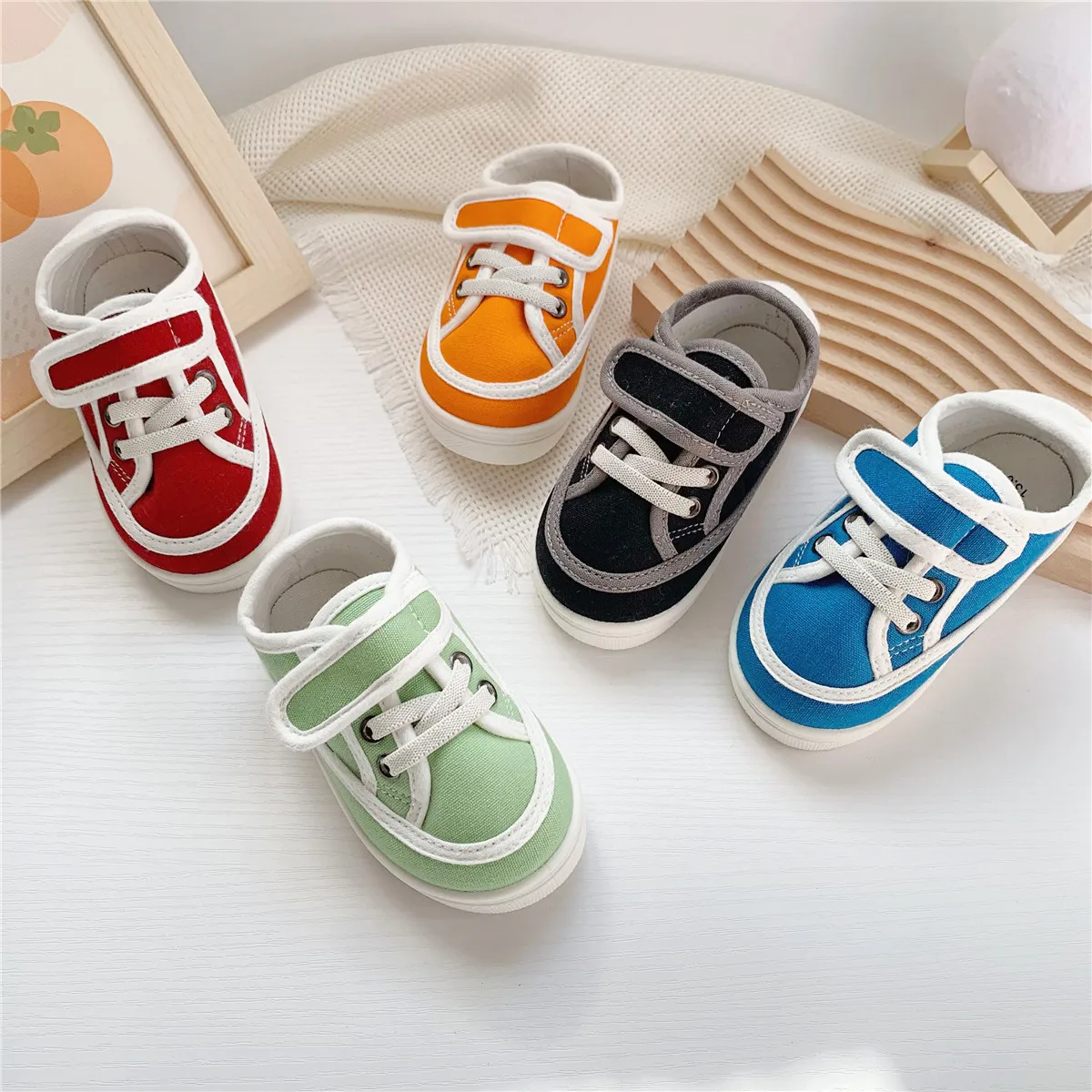 2025 japonés único nuevo producto Color sólido lindo AB bebé suela suave zapatos para caminar bordado zapatos casuales de tela para niños