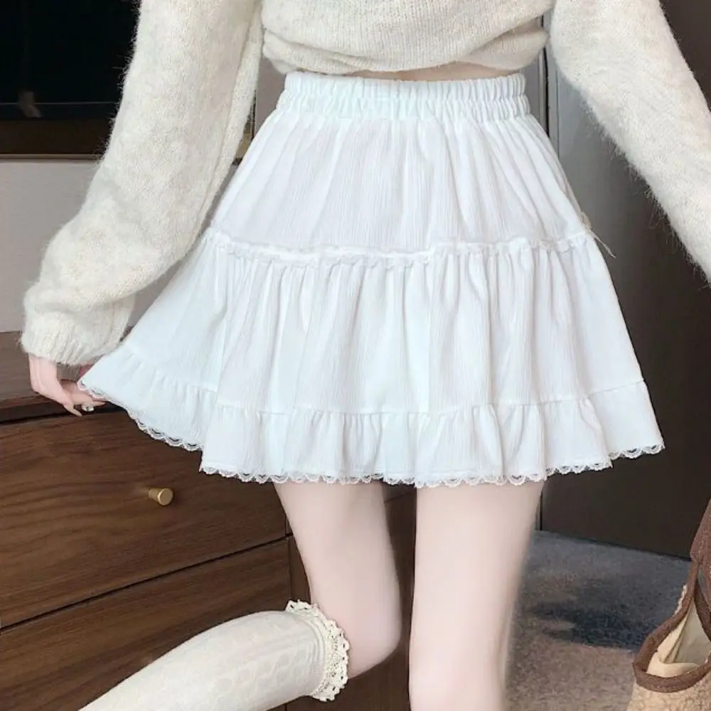 Minigonna corta da ragazza a vita alta con pantaloni di sicurezza Gonna a trapezio con fiocco allentato Abito da torta Minigonne a pieghe in pizzo con volant