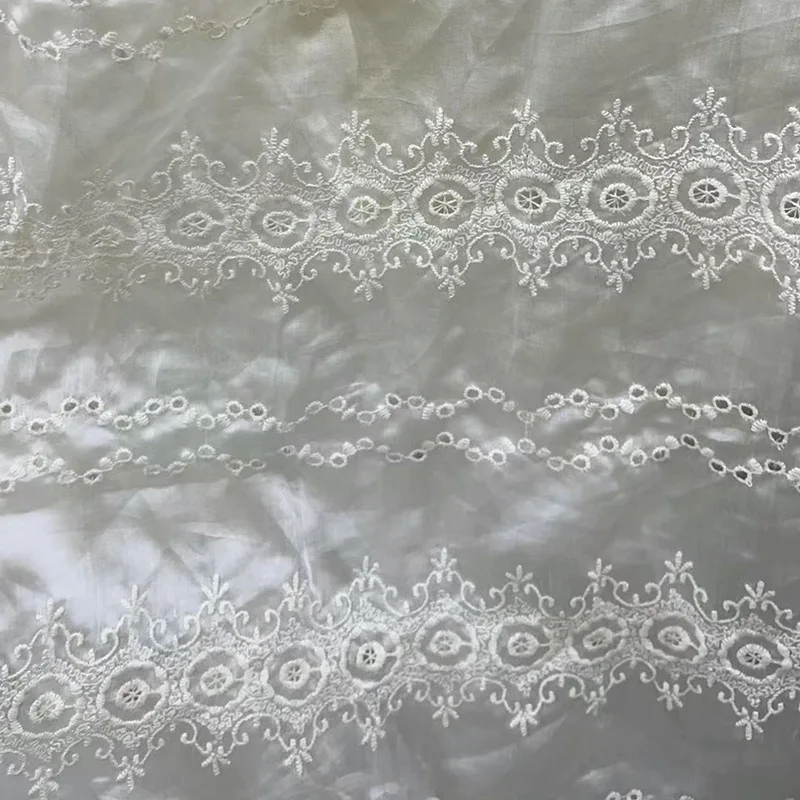 

Elegant lace embroidery apricot fabric is used for wedding dress making, home décor, dress quilted doll clothes sold by the yard