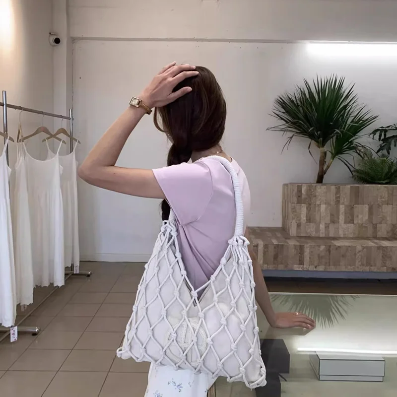 Bolso de hombro de diseño ahuecado de temporada para mujer, bolso de mano versátil con asa de punto, bolso de mano informal de estilo inglés