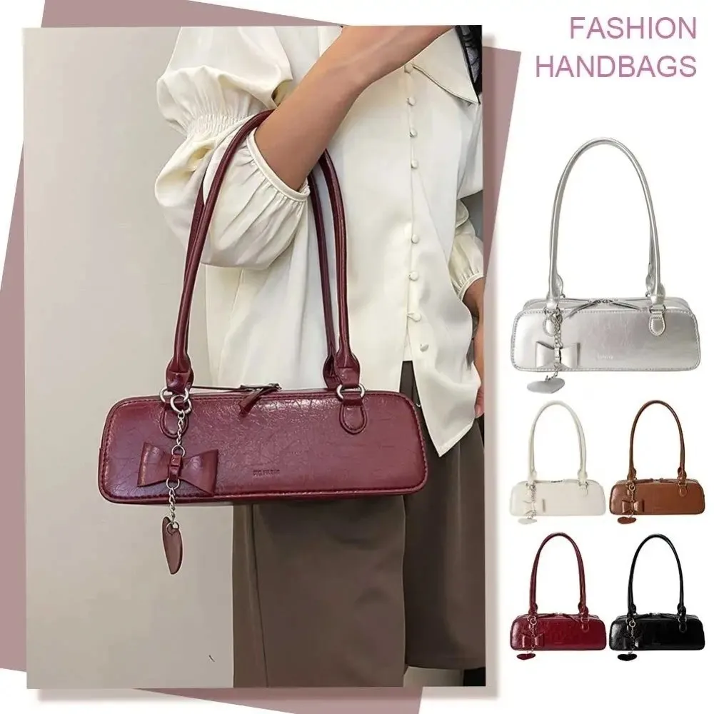 

Elegant French Stick Handbag Love Heart Pendant Large Capacity Sweet Armpit Bag Texture Solid Color Underarm Shoulder Bag Work