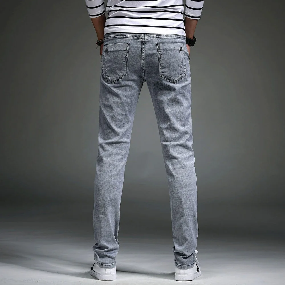 กางเกงยีนส์ผู้ชายสไตล์เกาหลีรุ่นใหม่ ทรงสลิม ยืดหยุ่น ทรงดินสอขายาว ใส่สบาย ทรงหลวม สำหรับผู้ใหญ่